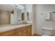 Well-lit bathroom with a spacious vanity, decorative jars, and tiled shower at 610 Riviera Dunes Way # 306, Palmetto, FL 34221