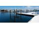 View of a boat lift and clear blue water on a sunny day at the marina at 610 Riviera Dunes Way # 306, Palmetto, FL 34221