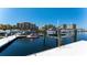 Scenic marina with multiple boat lifts and condos in the background on a clear day at 610 Riviera Dunes Way # 306, Palmetto, FL 34221