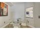 Cozy breakfast nook featuring a glass-top table, modern chairs, and neutral decor at 610 Riviera Dunes Way # 306, Palmetto, FL 34221
