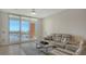 Cozy living room with tranquil water views and sophisticated decor, creating a relaxing and inviting atmosphere at 610 Riviera Dunes Way # 306, Palmetto, FL 34221