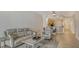 Comfortable living room with stylish seating, an open layout, and seamless flow into the adjacent dining area and kitchen at 610 Riviera Dunes Way # 306, Palmetto, FL 34221
