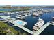A picturesque marina featuring docks with swimming pools and many boats with views of the beautiful waterfront landscape at 610 Riviera Dunes Way # 306, Palmetto, FL 34221