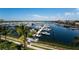 Aerial view of a marina filled with boats and yachts under a bright blue sky at 610 Riviera Dunes Way # 306, Palmetto, FL 34221