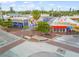 Aerial view of island businesses featuring colorful buildings and outdoor seating under a sunny sky at 627 Avenida Del Norte, Sarasota, FL 34242