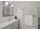 Bright bathroom with updated vanity, mirror and lighting at 627 Avenida Del Norte, Sarasota, FL 34242