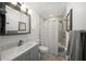 Bathroom with tile floors, a tub shower, and updated vanity with mirror at 627 Avenida Del Norte, Sarasota, FL 34242