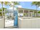 Picturesque beach pavilion with picnic tables and information signs, surrounded by palm trees at 627 Avenida Del Norte, Sarasota, FL 34242
