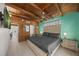 Bedroom with wood floors, wood-beam ceiling, tv, and connected bathroom and dining area at 627 Avenida Del Norte, Sarasota, FL 34242