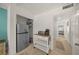 View of a hallway with a refrigerator, coffee maker and toaster, and access to other rooms at 627 Avenida Del Norte, Sarasota, FL 34242