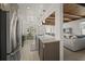 Open-concept kitchen showcasing stainless steel appliances, granite countertops, and seamless flow to the living area at 627 Avenida Del Norte, Sarasota, FL 34242