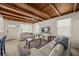 Inviting living area featuring a wood-beamed ceiling, neutral decor, and ample natural light at 627 Avenida Del Norte, Sarasota, FL 34242