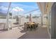Screened-in patio with a dining table and chairs, ideal for outdoor entertaining and relaxation at 627 Avenida Del Norte, Sarasota, FL 34242
