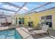 Relaxing screened-in pool area with lounge chairs and outside dining at 627 Avenida Del Norte, Sarasota, FL 34242
