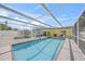 Full view of the screened-in swimming pool with access to the home and a storage shed at 627 Avenida Del Norte, Sarasota, FL 34242