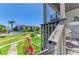 Enjoy the community view from this cozy balcony overlooking lush landscaping and the pool at 6840 Midnight Pass Rd # 6840, Sarasota, FL 34242
