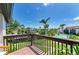 Condo balcony with views of a swimming pool and palm trees at 6840 Midnight Pass Rd # 6840, Sarasota, FL 34242