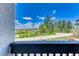 Balcony with view of the road and surrounding foliage at 6840 Midnight Pass Rd # 6840, Sarasota, FL 34242