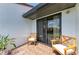 Patio with chairs and sliding glass door, perfect for relaxing at 6840 Midnight Pass Rd # 6840, Sarasota, FL 34242