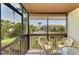 Enjoy the outdoors on this screened balcony with views of lush greenery and the community pool at 6840 Midnight Pass Rd # 6840, Sarasota, FL 34242