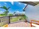 Balcony overlooking the community pool, mature trees and landscaped grounds at 6840 Midnight Pass Rd # 6840, Sarasota, FL 34242