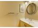 Bathroom features vanity with sink and large round mirror at 6840 Midnight Pass Rd # 6840, Sarasota, FL 34242