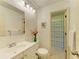 Bathroom featuring a vanity and a shower with seashell curtain at 6840 Midnight Pass Rd # 6840, Sarasota, FL 34242