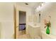 Bathroom featuring a vanity and stairs to another level of the home at 6840 Midnight Pass Rd # 6840, Sarasota, FL 34242