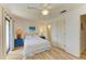 Bright bedroom featuring a ceiling fan, and ensuite bathroom with vanity at 6840 Midnight Pass Rd # 6840, Sarasota, FL 34242