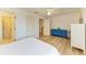 Bedroom with wood floors, ceiling fan, closet and ensuite bathroom at 6840 Midnight Pass Rd # 6840, Sarasota, FL 34242