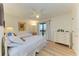 Bright bedroom with two twin beds, ceiling fan, and closet at 6840 Midnight Pass Rd # 6840, Sarasota, FL 34242
