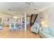 Bright, open-concept area with a dining table and a staircase, perfect for entertaining and everyday living at 6840 Midnight Pass Rd # 6840, Sarasota, FL 34242
