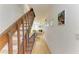 Inviting entryway with wooden staircase, leading to a cozy living room with a fireplace at 6840 Midnight Pass Rd # 6840, Sarasota, FL 34242