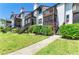 Charming condo exterior featuring well-maintained landscaping and private balconies for each unit at 6840 Midnight Pass Rd # 6840, Sarasota, FL 34242