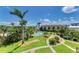 Well maintained lawns and sidewalks surround the beautiful pool and multi-Gathering homes at 6840 Midnight Pass Rd # 6840, Sarasota, FL 34242