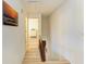 Hallway with stairway and artwork on the walls at 6840 Midnight Pass Rd # 6840, Sarasota, FL 34242