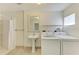 Convenient laundry room with washer, dryer, and shower at 6840 Midnight Pass Rd # 6840, Sarasota, FL 34242