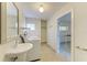 Bright laundry room with tile floor, washer, sink, and convenient access to another room at 6840 Midnight Pass Rd # 6840, Sarasota, FL 34242