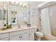 Bright bathroom featuring a bathtub-shower combination and a large mirror at 6851 Bay Hill Dr, Lakewood Ranch, FL 34202