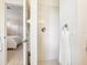 Bright bathroom featuring a white tiled shower and bedroom access at 6851 Bay Hill Dr, Lakewood Ranch, FL 34202