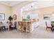Open-concept kitchen with bar seating and an adjacent dining area at 6851 Bay Hill Dr, Lakewood Ranch, FL 34202