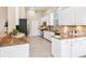 Spacious kitchen featuring white cabinetry, granite countertops, and stainless steel appliances at 6851 Bay Hill Dr, Lakewood Ranch, FL 34202
