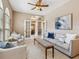 Comfortable living room with stylish furnishings and a view to adjacent dining area at 6851 Bay Hill Dr, Lakewood Ranch, FL 34202