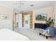 Serene main bedroom featuring plush carpeting and a sliding glass door to an outdoor area at 6851 Bay Hill Dr, Lakewood Ranch, FL 34202