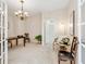 Bright home office with a desk, stylish chair, and open doorway at 6851 Bay Hill Dr, Lakewood Ranch, FL 34202