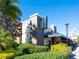 Restaurant exterior with lush landscaping, modern design, prominent signage, and ample parking available at 6851 Bay Hill Dr, Lakewood Ranch, FL 34202