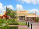 Inviting restaurant exterior with ample natural light and outdoor seating, creating a welcoming atmosphere at 6851 Bay Hill Dr, Lakewood Ranch, FL 34202
