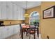 Cozy dining area with abundant cabinet space and a sunlit window at 6908 Stoneywalk Ct, Bradenton, FL 34203
