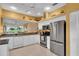 Bright kitchen featuring stainless steel appliances and ample countertop space at 6908 Stoneywalk Ct, Bradenton, FL 34203
