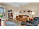 Inviting living room offering cozy seating, bookshelves, and relaxing atmosphere at 6908 Stoneywalk Ct, Bradenton, FL 34203
